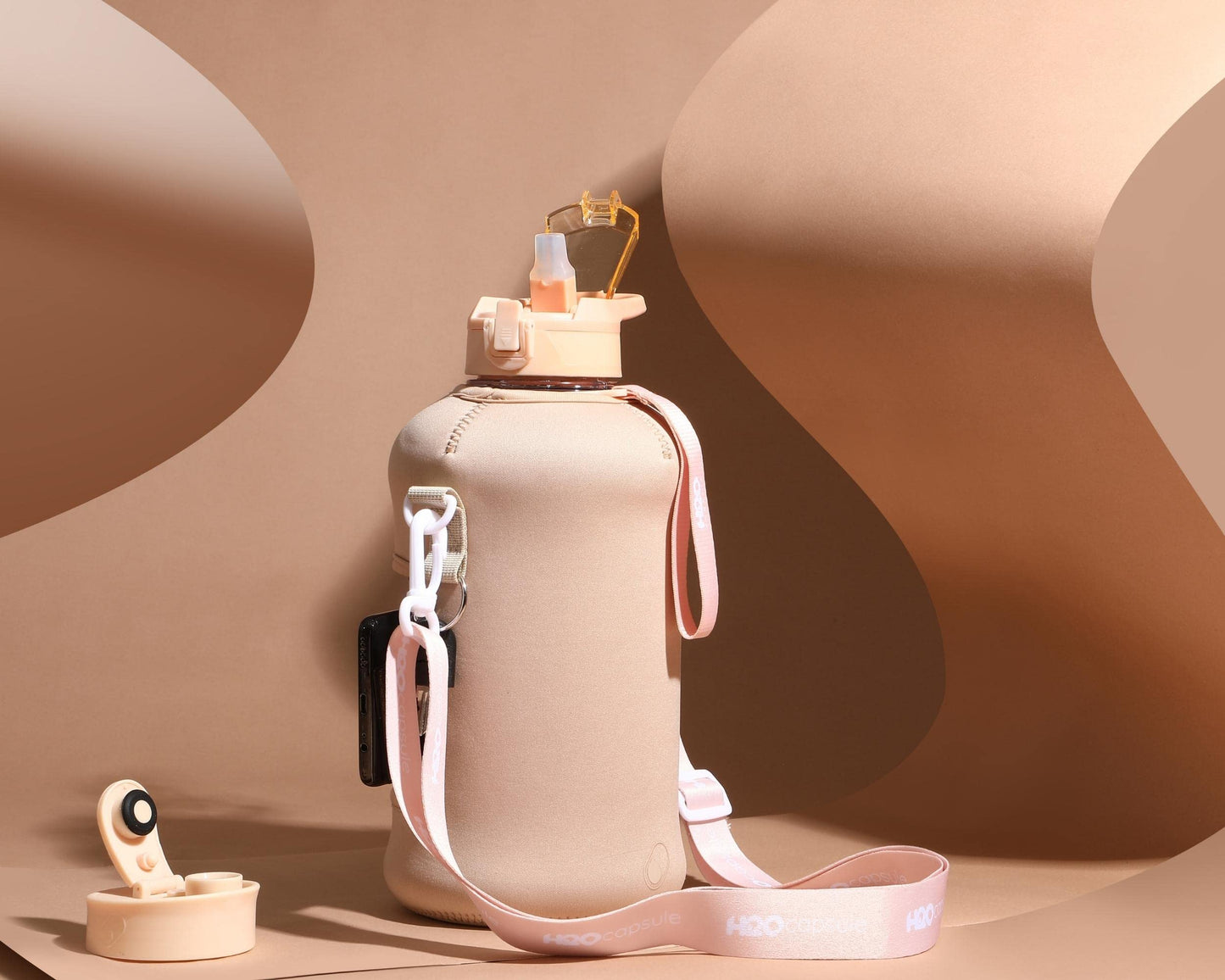 H2O Capsule 2.2L Half Gallon Water Bottle with Storage Sleeve and Covered Straw Lid – BPA Free Large Reusable Drink Container with Handle - Big Sports Jug, 2.2 Liter (74 Ounce), Sandy Beige