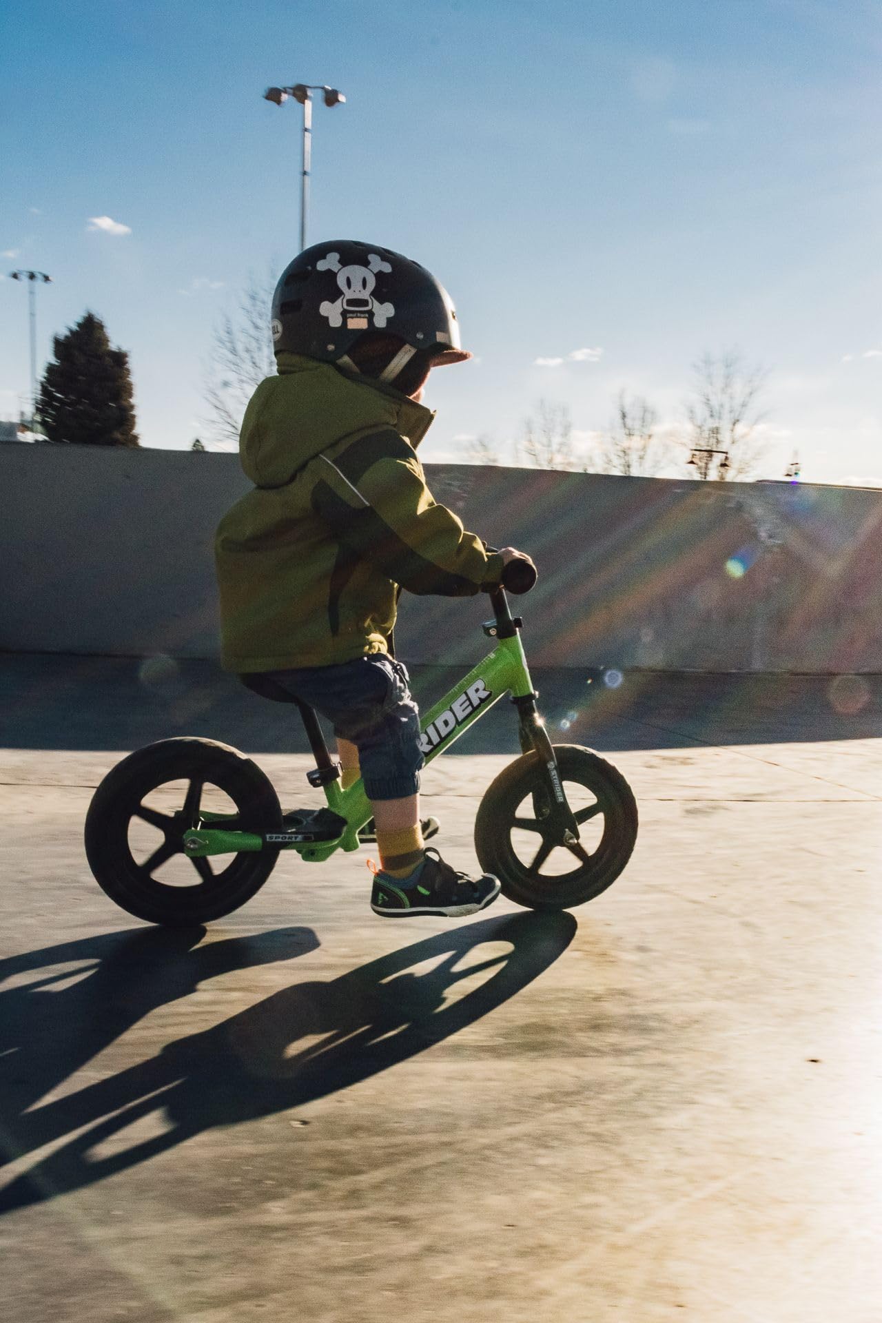 Strider 12” Sport Bike, Green - No Pedal Balance Bicycle for Kids 1 to 4 Years - Includes Safety Pad, Padded Seat, Mini Grips & Flat-Free Tires - Tool-Free Assembly & Adjustments