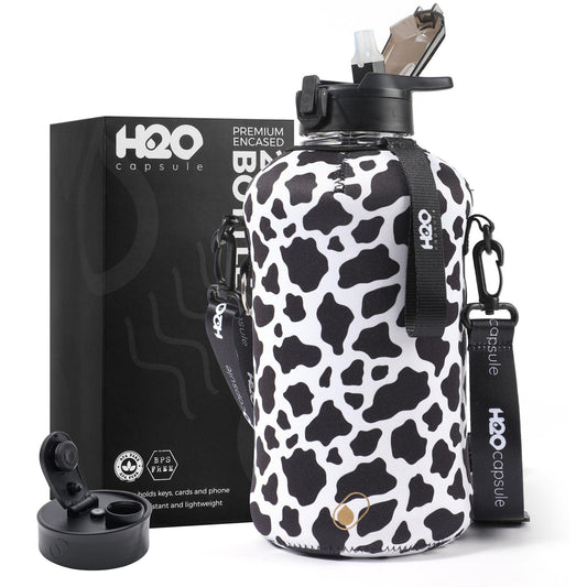 H2O Capsule 2.2L Half Gallon Water Bottle with Storage Sleeve and Covered Straw Lid – BPA Free Large Reusable Drink Container with Handle - Big Sports Jug, 2.2 Liter (74 Ounce) Cowbell